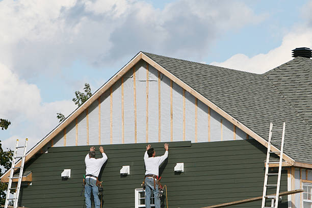 Professional Storm Damage Siding Repair technician working in Oregonia, OH
